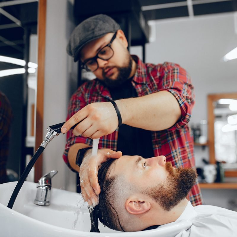 Stylish man sitting in a barbershop